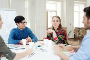 A group of students at Ignite A*, the premium tutoring school for international students, are brainstorming about the international curricula.