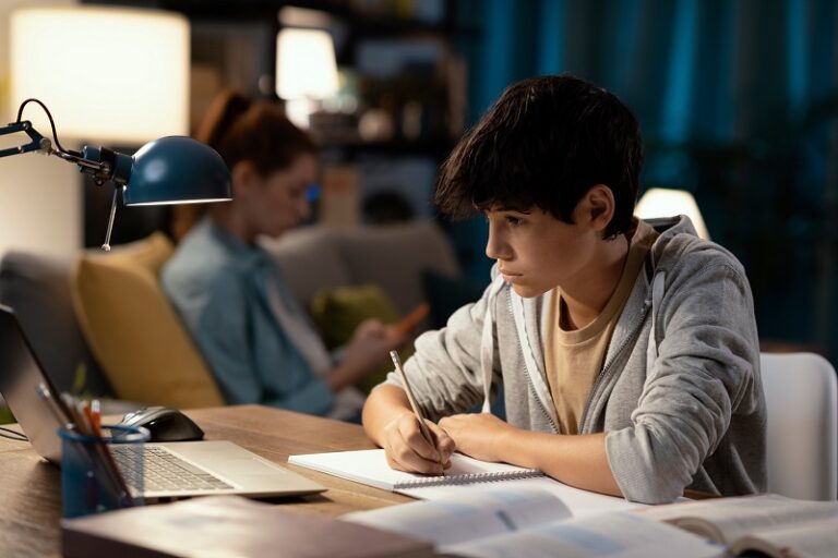 A young boy is preparing for his international curricula exam with Pearson Edexcel exam board that he is going to take at the exam center at Ignite A*.