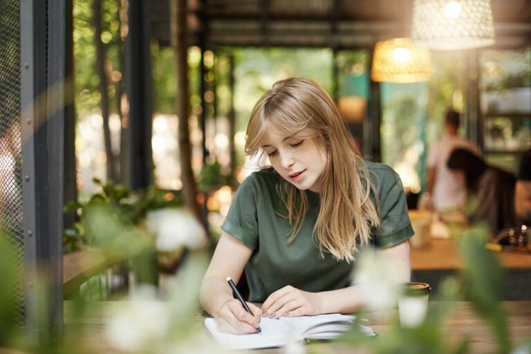 A young blond hair student is working and taking an international curricula exam with Pearson Edexcel board at ignite A* exam center.