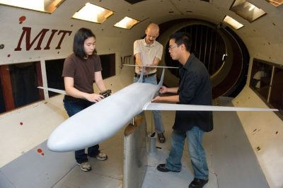 A group of students from MIT, Aerospace, are creating a model of an airplane.