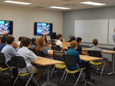 Students in University of Michigan –Environmental Engineering are studing with a teacher as a group studying.