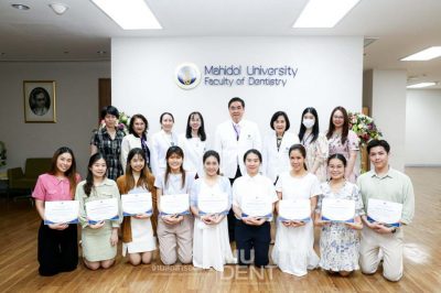 A group of teachers and students from Doctor of Dental Surgery Program (International Program), Mahidol International Dental School, are taking a photo together.